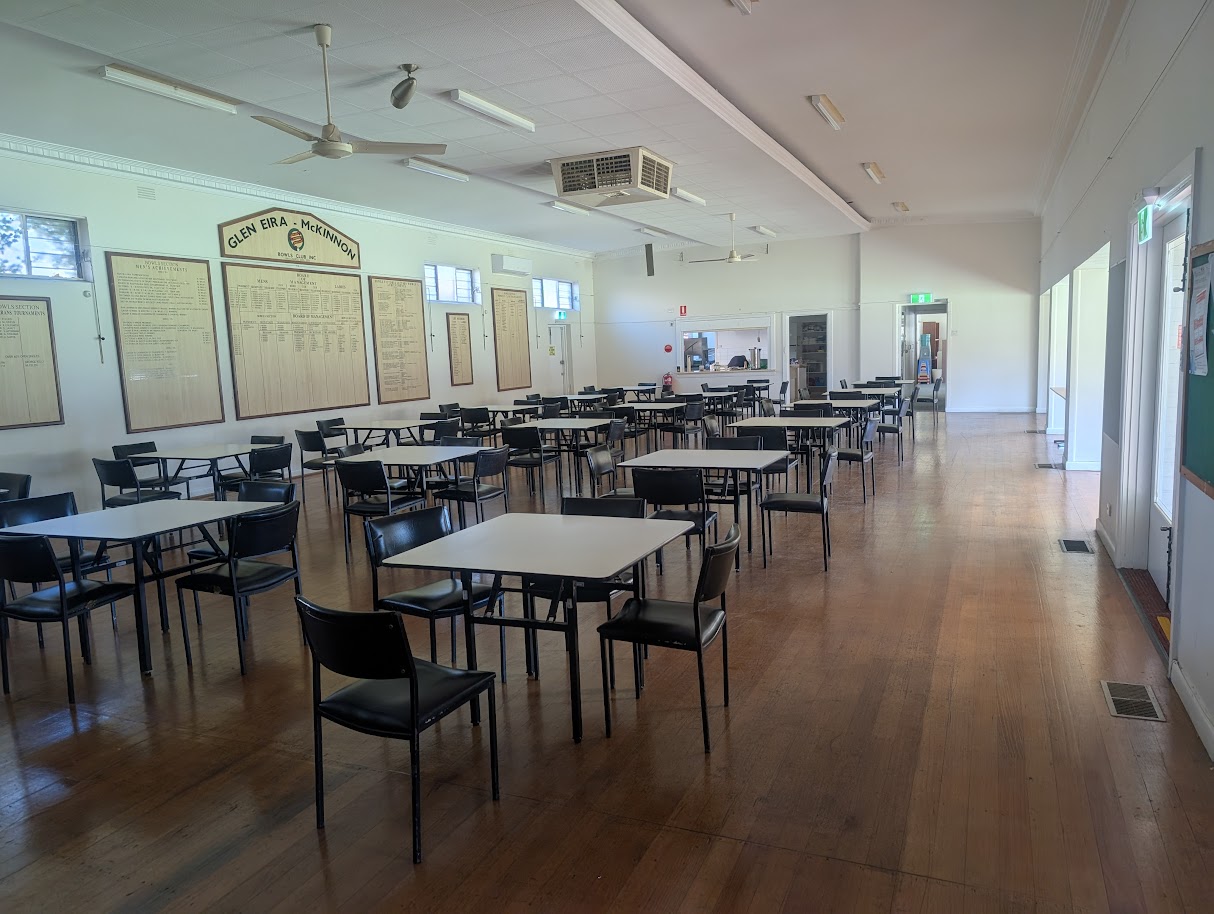 empty function room set up with tables and chairs